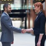 business man and woman hand shake