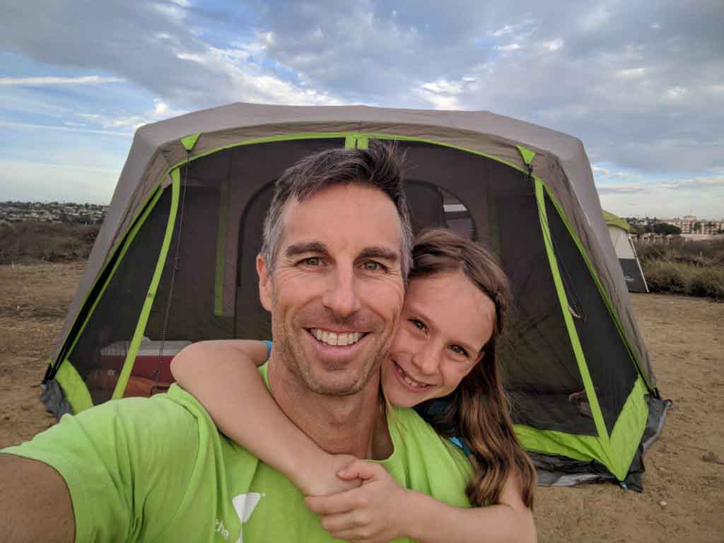 Dad smiling with his daughter