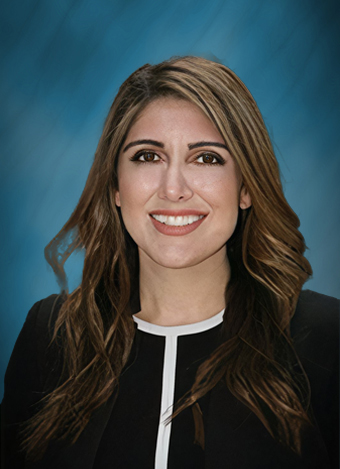 female men's equal rights lawyer in a white blazer