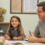 A dad along with his child in an office to discuss child custody with a legal advisor.