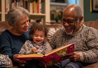 Grandparents reading with their grandchild.
