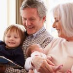 Grandparents spending time with their grandkids in the living room.