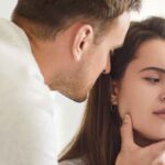 Man and woman in a tense moment showing signs of domestic violence