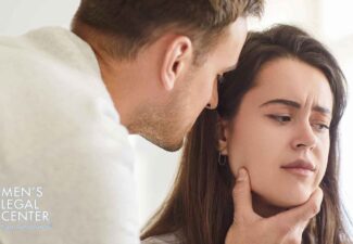 Man and woman in a tense moment showing signs of domestic violence