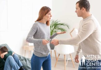 Man handing money to a woman with their child in the living room
