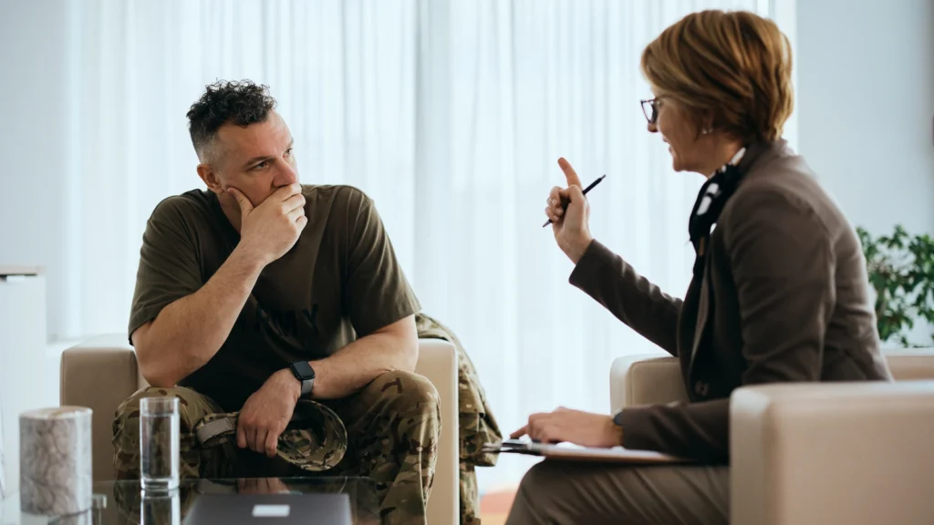 Service member in uniform speaking with an attorney