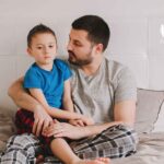 Man spending time with his child during a home visit