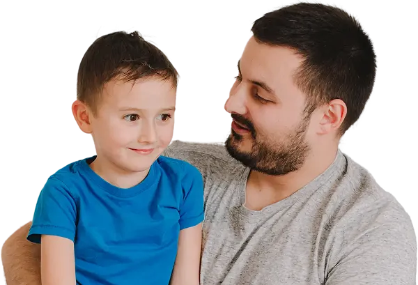 Man with beard in gray shirt holding young boy in blue shirt, both smiling.